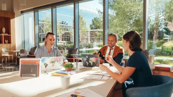 A group of businessmen discussing a project around a table