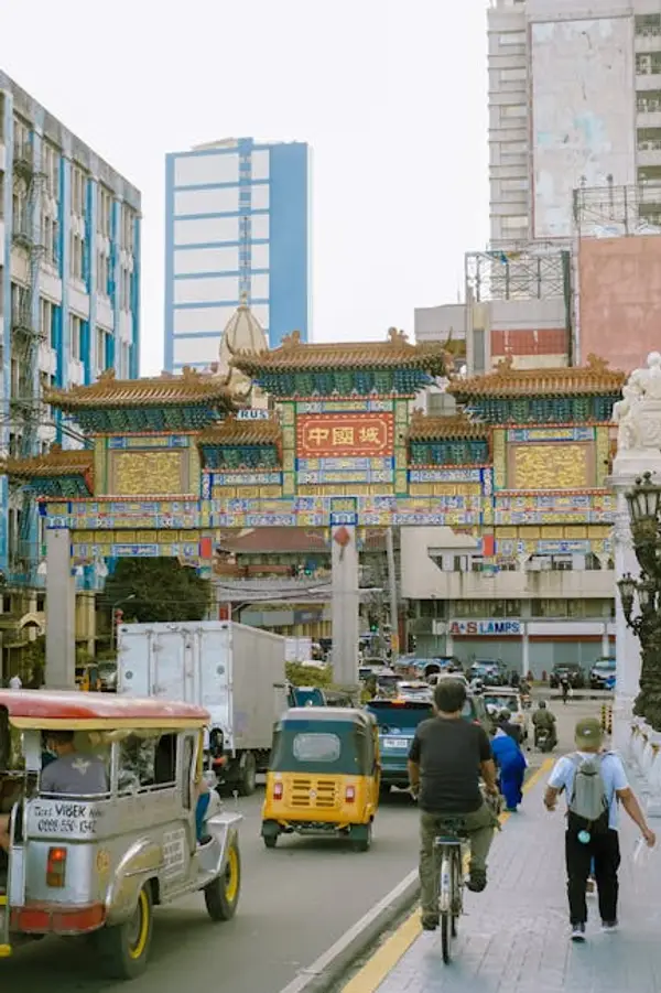 A busy city street with cars and people