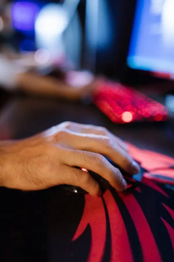 A competitive gaming setup with monitors and gaming gear