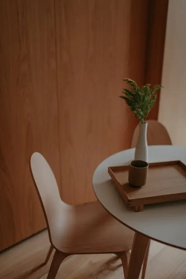 A cozy home workspace setup with laptop and coffee