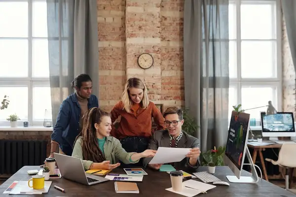 A diverse group of people working together in an office setting