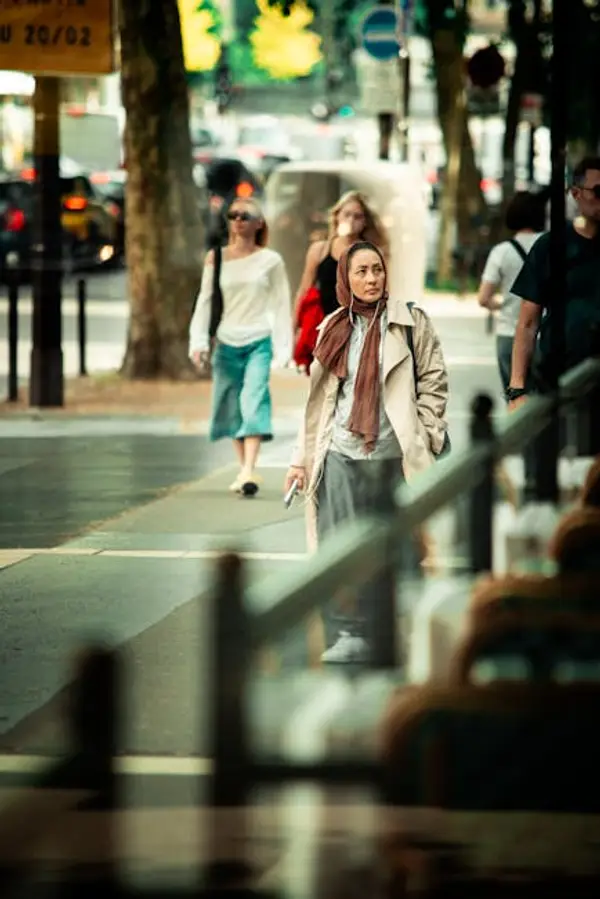 People walking on a busy city street during daytime