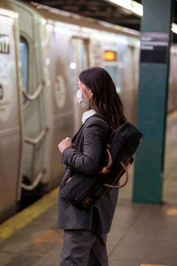 A busy train station platform with travelers
