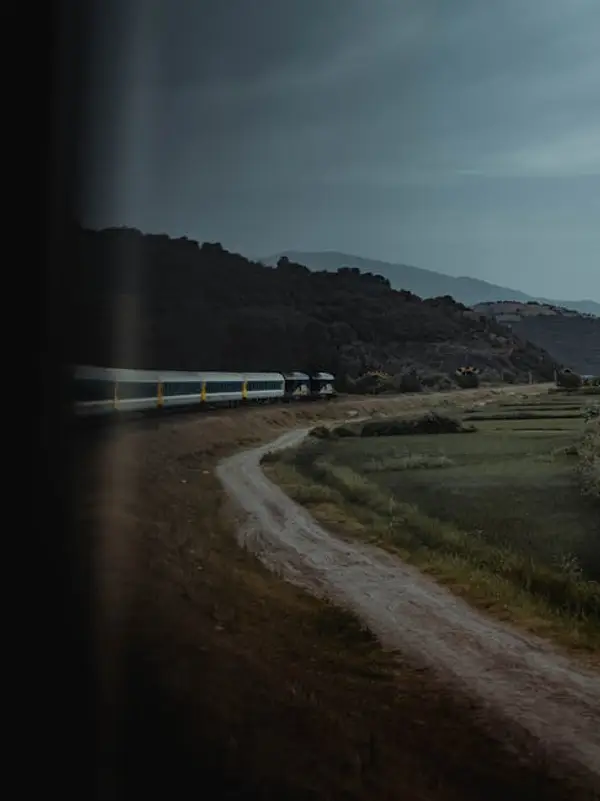 Train traveling through beautiful countryside